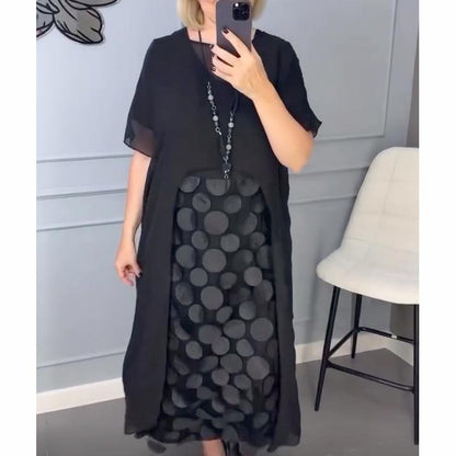 Elegáns, V-nyakú, fekete női ruha, szabálytalan zakóval, kétrészes szett