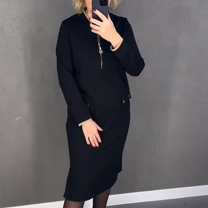 Elegáns fekete női ruha hosszú ujjal és cipzárral